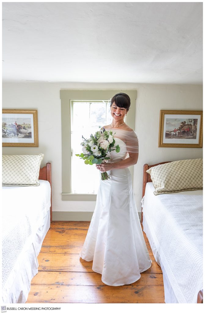 smiling bride standing in bedroom